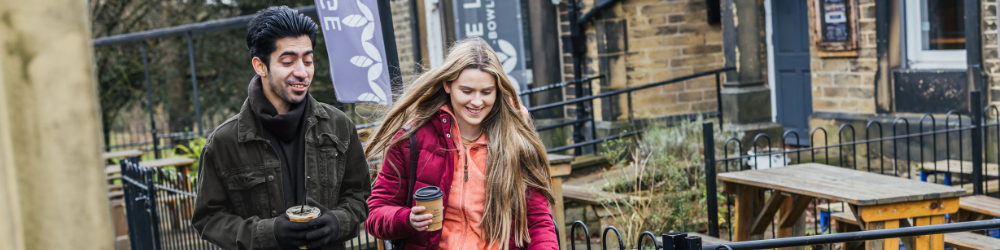 Two friends enjoying a walk in Bowling Park Bradford