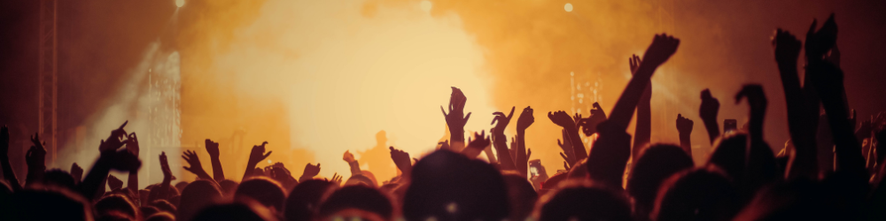 People at a gig with hands in the air